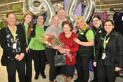 Asda Rushden customer Olive Lovell celebrating her 90th birthday with colleagues